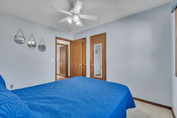 a view of a livingroom with a chandelier fan