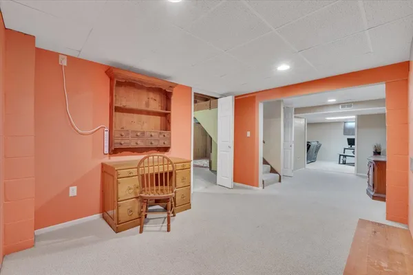 a view of a room with a birdcage and a window