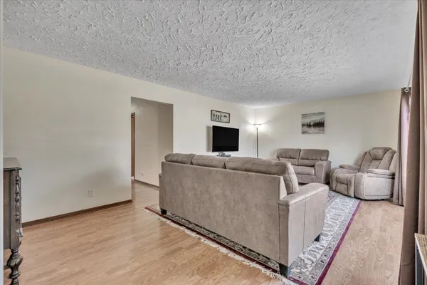 a living room with furniture and a table
