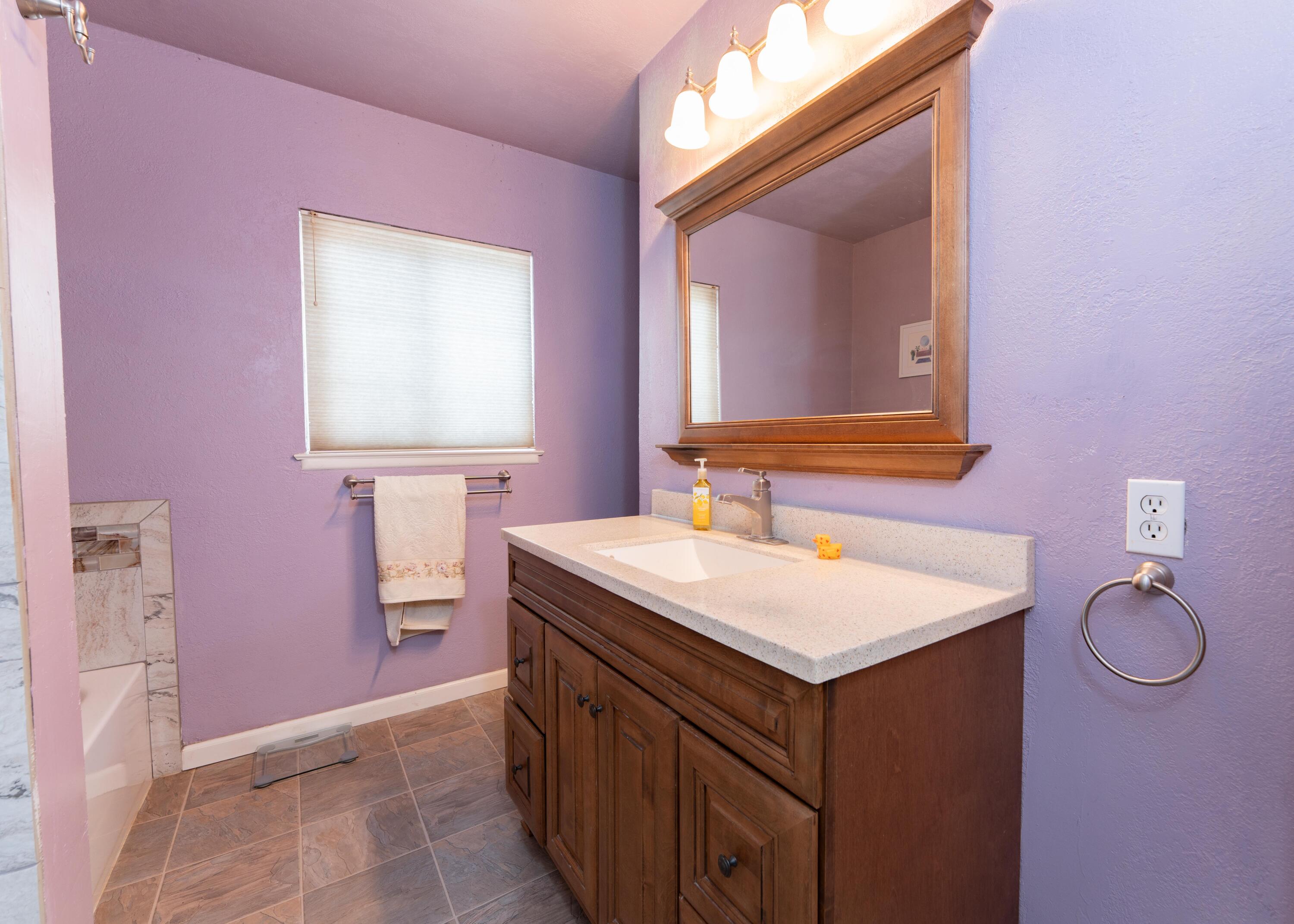 570 North Birch Avenue Reedley, CA 93654 - Photo 35 of 52 a bathroom with a sink vanity and a mirror