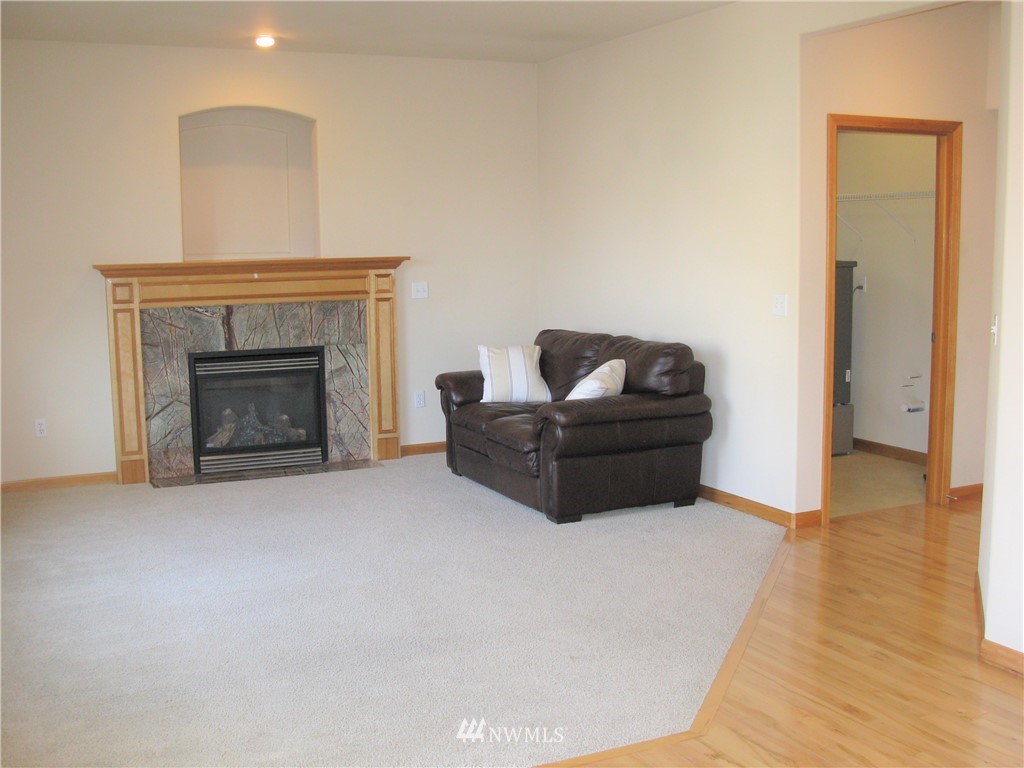 1219 187th Street Southeast Bothell, WA 98012 - Photo 18 of 39 a living room with furniture and a fireplace