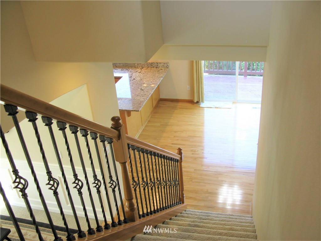 1219 187th Street Southeast Bothell, WA 98012 - Photo 22 of 39 a view of staircase with railing and a window