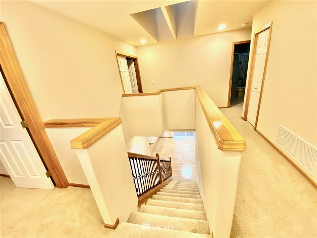 1219 187th Street Southeast Bothell, WA 98012 - Photo 23 of 39 a view of a balcony with wooden floor