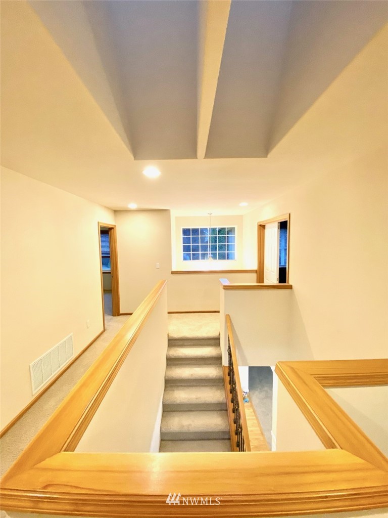 1219 187th Street Southeast Bothell, WA 98012 - Photo 24 of 39 a view of entryway and hall with wooden floor