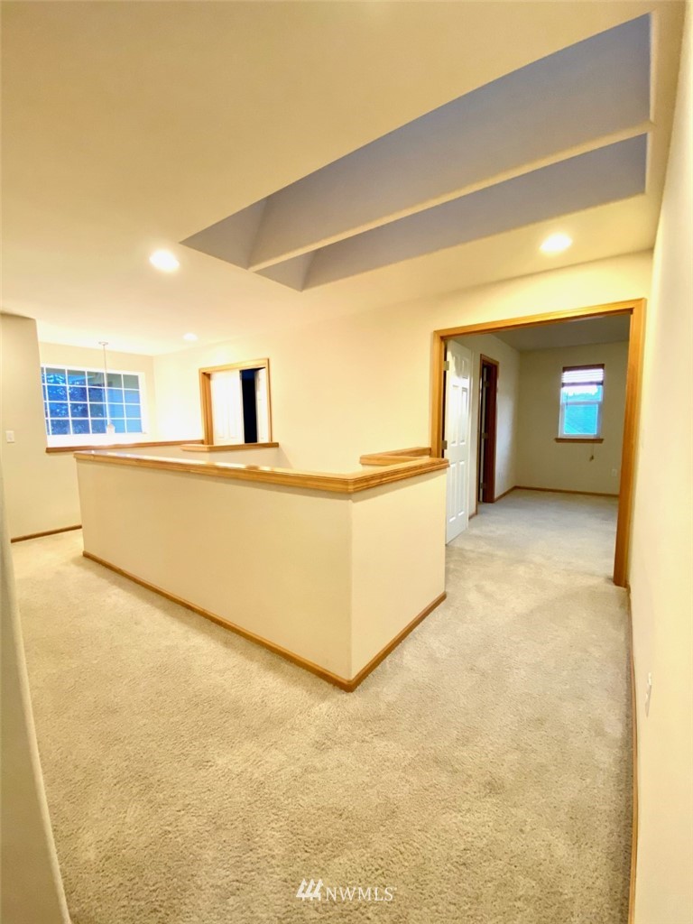 1219 187th Street Southeast Bothell, WA 98012 - Photo 25 of 39 a view of a big room with wooden floor and a fireplace