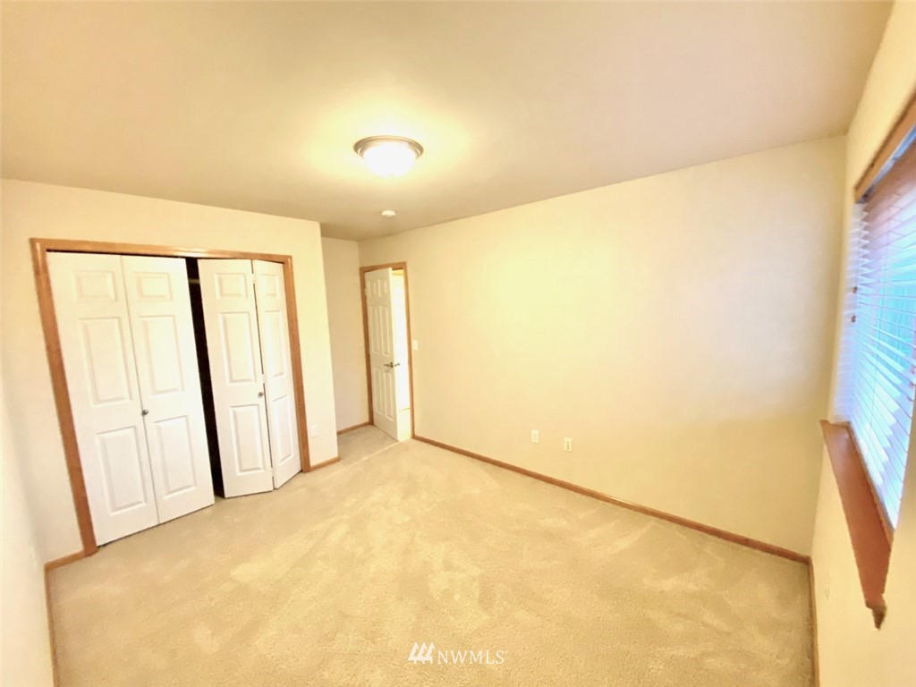 1219 187th Street Southeast Bothell, WA 98012 - Photo 32 of 39 a view of an empty room with a window