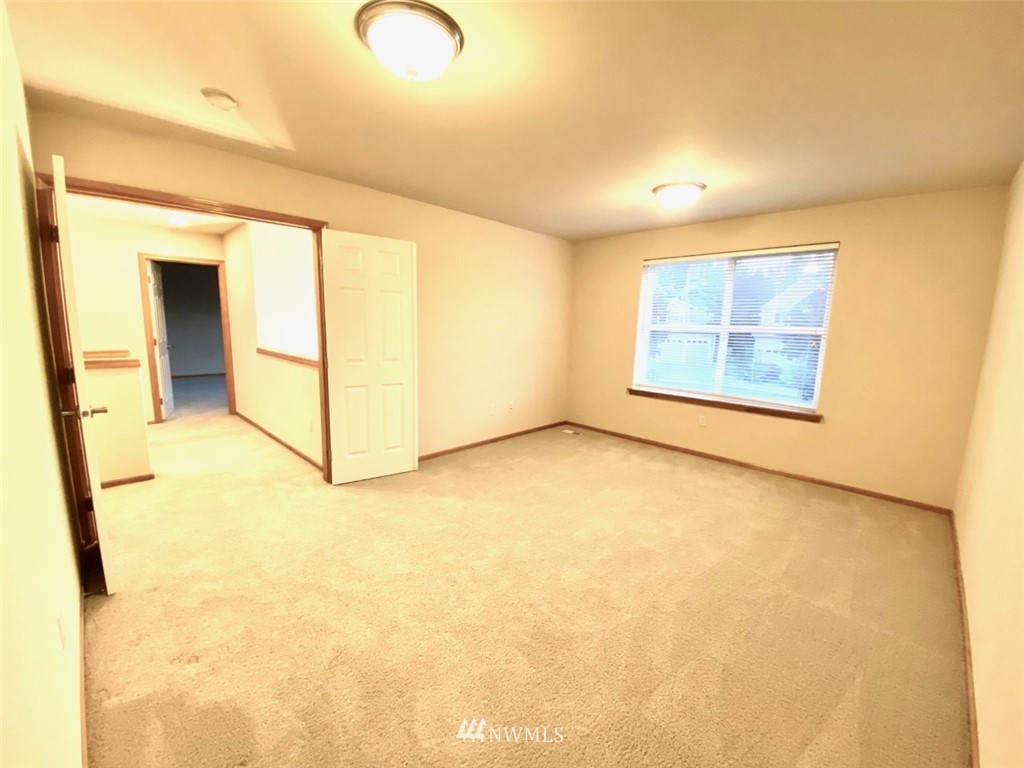 1219 187th Street Southeast Bothell, WA 98012 - Photo 34 of 39 an empty room with windows