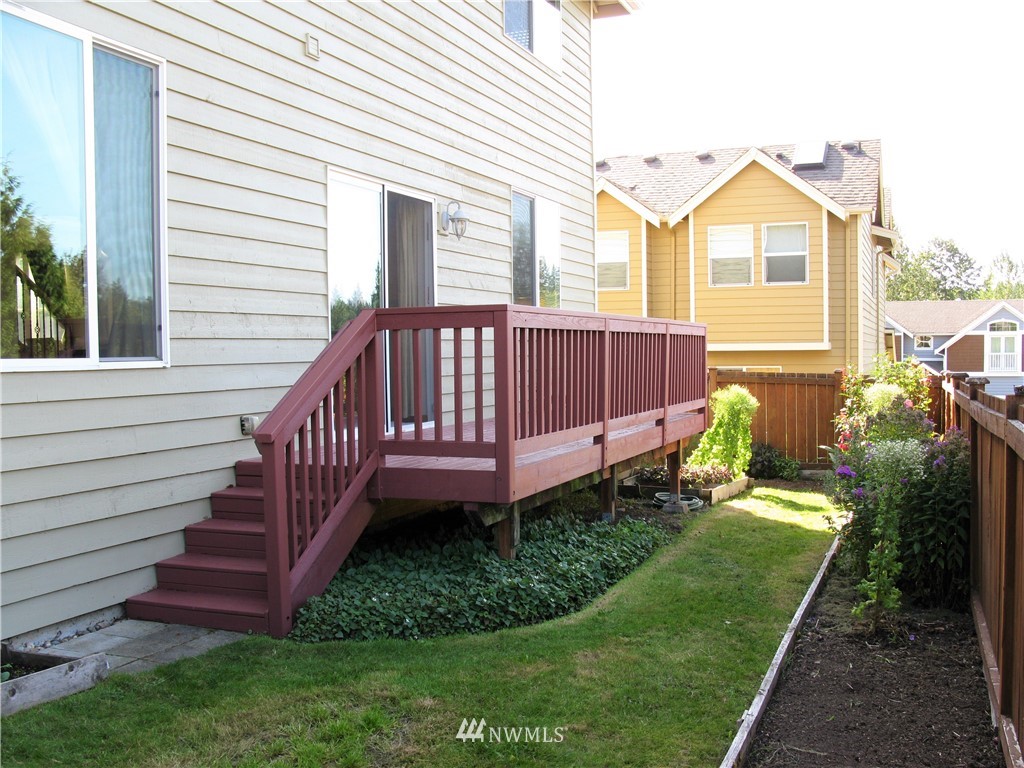 1219 187th Street Southeast Bothell, WA 98012 - Photo 36 of 39 a view of a house with a yard and sitting area