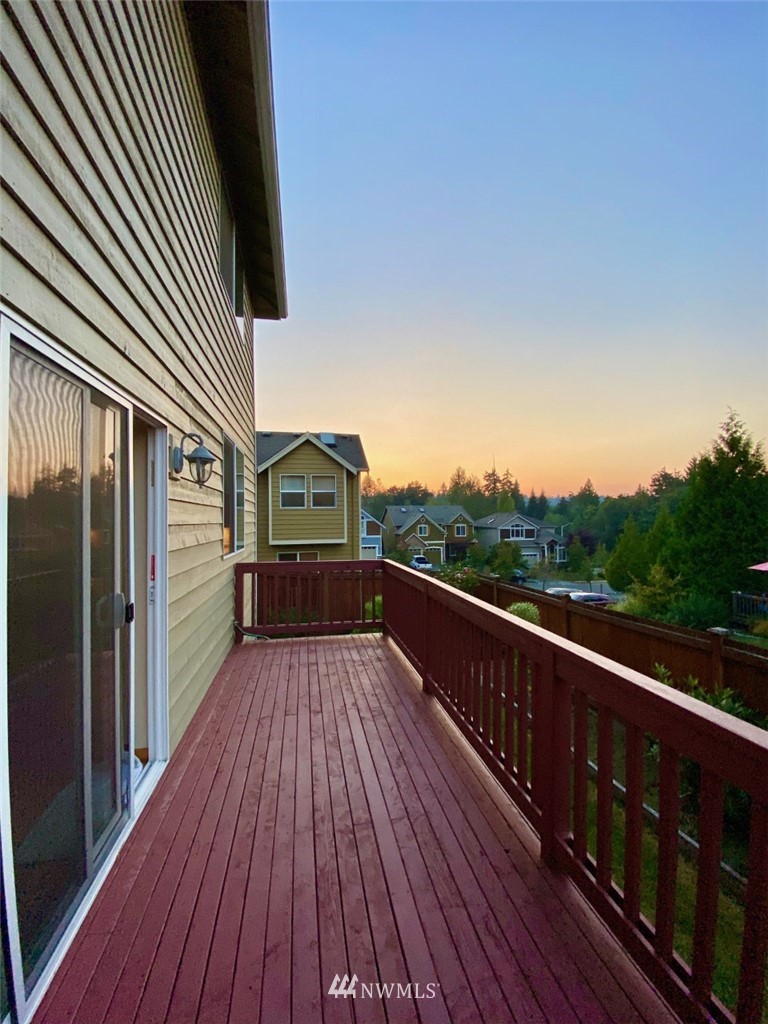 1219 187th Street Southeast Bothell, WA 98012 - Photo 38 of 39 a view of balcony with wooden floor and fence