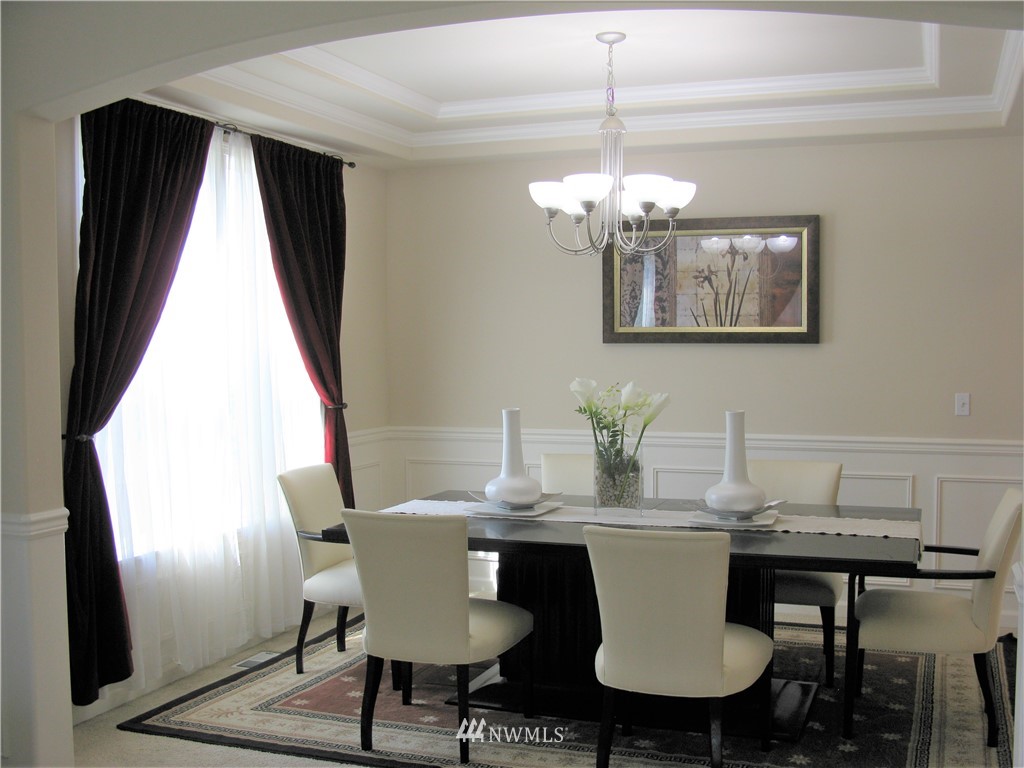 1219 187th Street Southeast Bothell, WA 98012 - Photo 6 of 39 a view of a dining room with furniture window and outside view