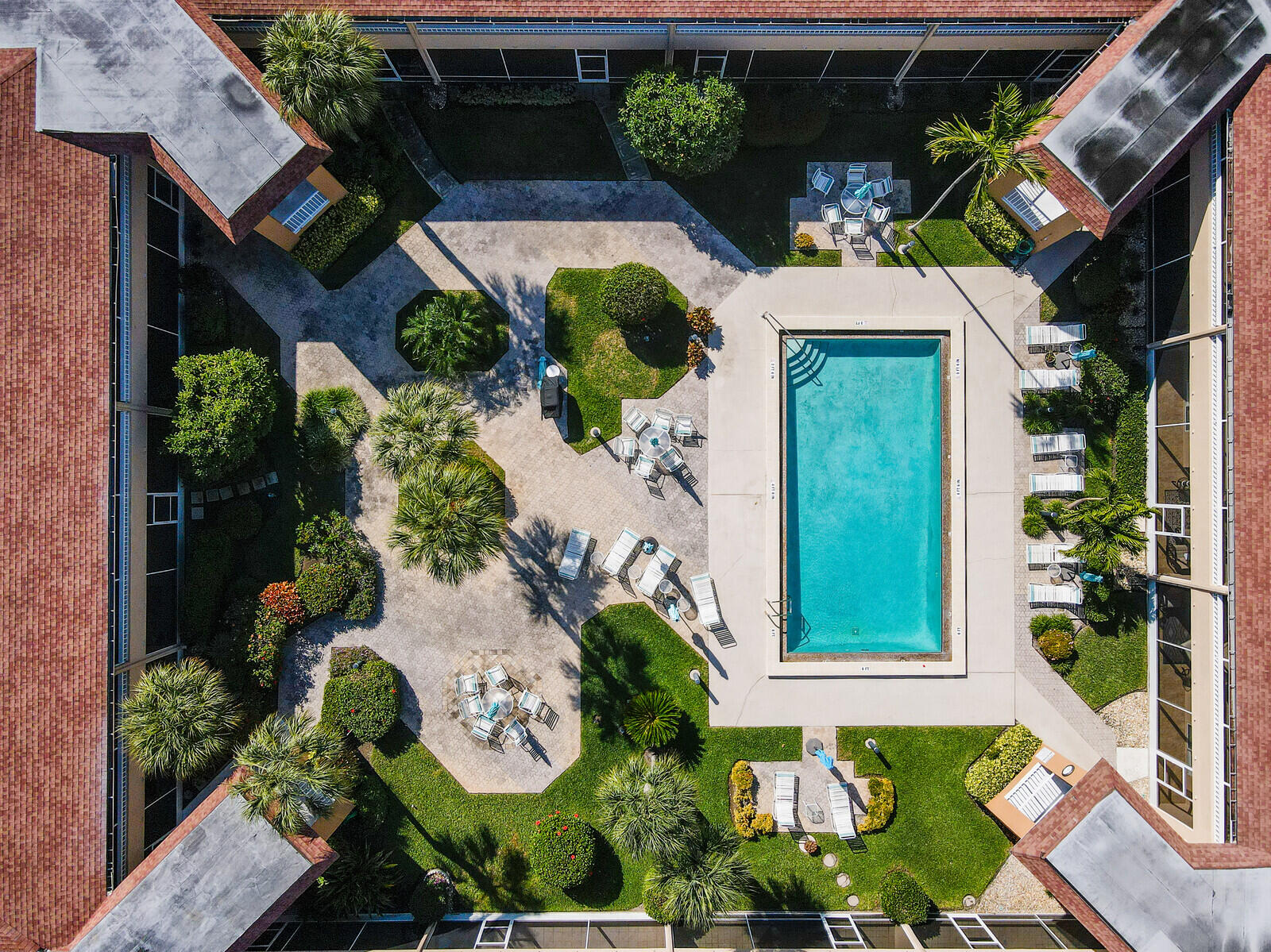 1100 Surf Road, Unit 106 Singer Island, FL 33404 - Photo 32 of 39 COURTYARD POOL AREA