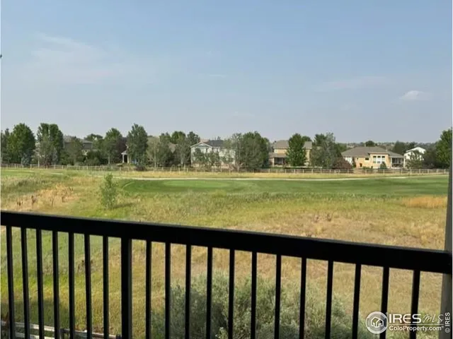 a view of lake and mountain from a balcony