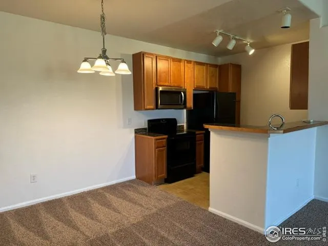 a view of kitchen and chandelier