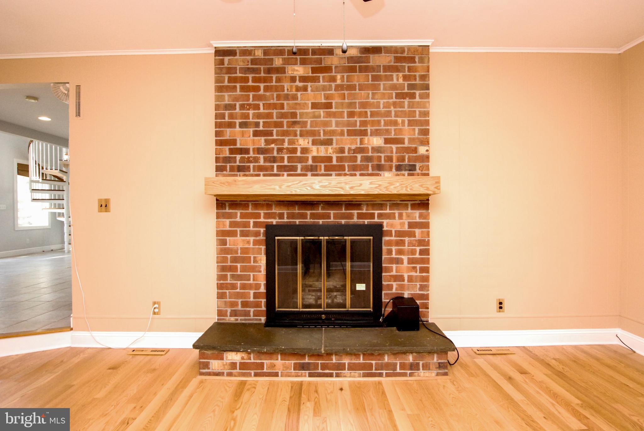 614 Venture Road Hockessin, DE 19707 - Photo 14 of 47 Family room fireplace