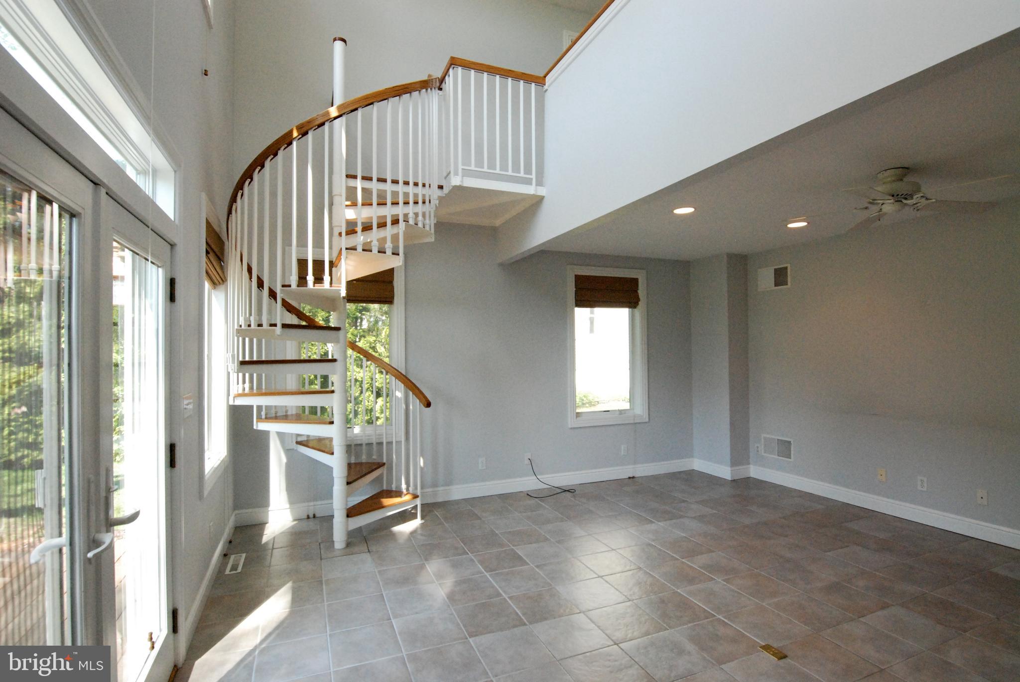 614 Venture Road Hockessin, DE 19707 - Photo 17 of 47 Spiral stairway from great room to loft/office