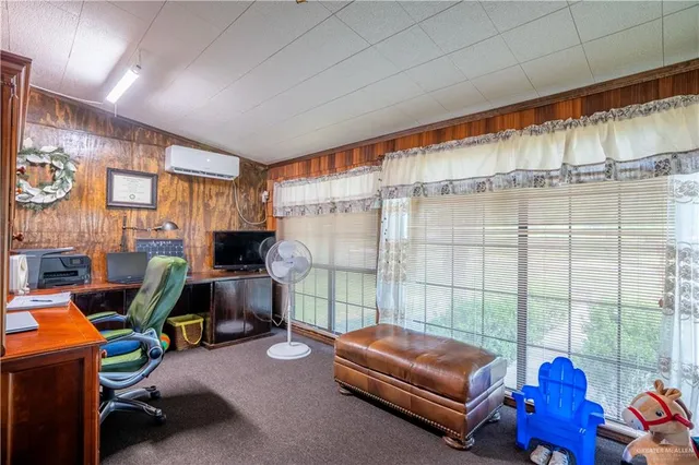 a work room with furniture and a chandelier
