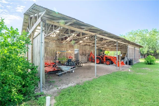a view of a chairs and tables in the back yard of the house
