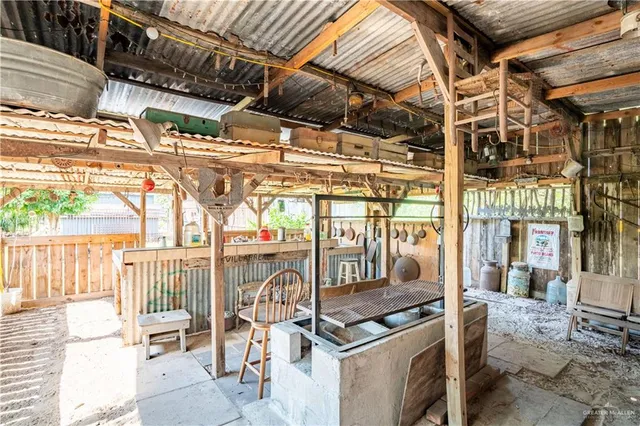 a view of a chairs and table in the patio