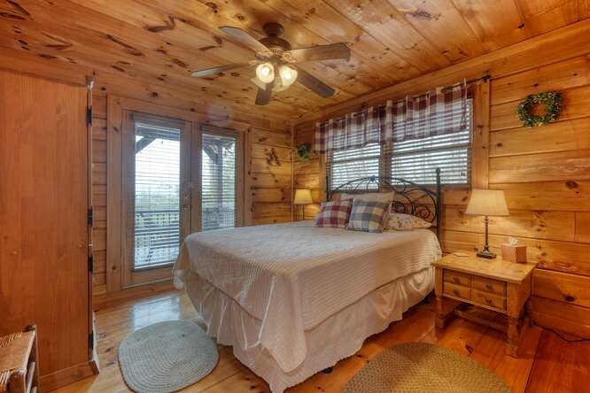 76 Channing Hollow Morganton, GA 30560 - Photo 14 of 47 a spacious bedroom with a bed a table and chair with the outer view