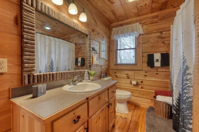 76 Channing Hollow Morganton, GA 30560 - Photo 16 of 47 a bathroom with a sink double vanity and a mirror
