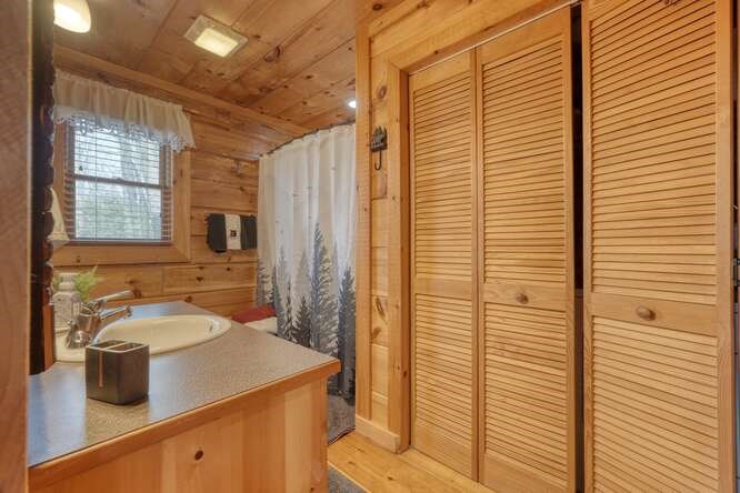 76 Channing Hollow Morganton, GA 30560 - Photo 17 of 47 a bathroom with a sink and a mirror