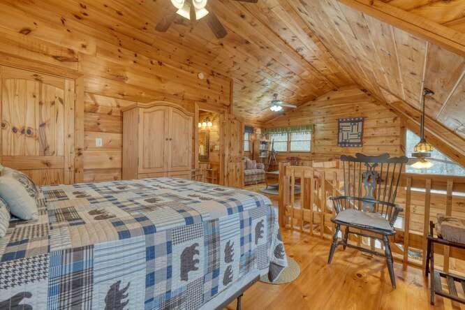 76 Channing Hollow Morganton, GA 30560 - Photo 23 of 47 a spacious bedroom with a bed and wooden floor