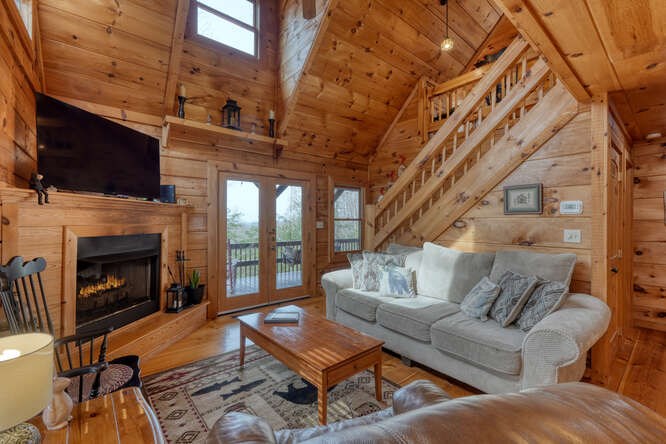 76 Channing Hollow Morganton, GA 30560 - Photo 5 of 47 a living room with furniture a flat screen tv and a fireplace