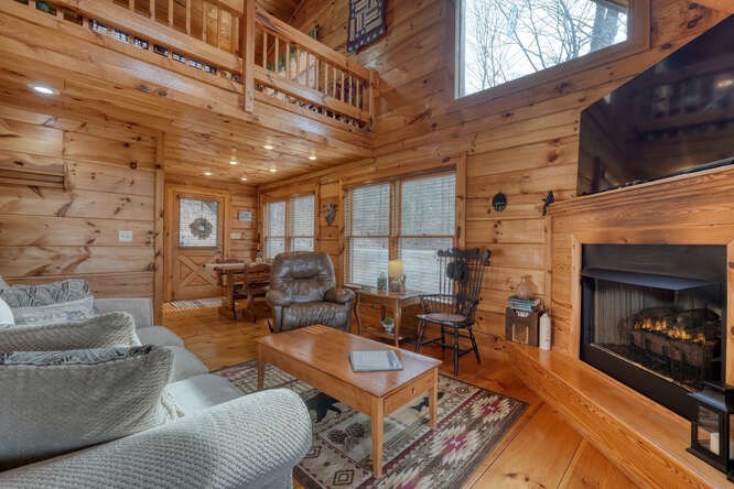 76 Channing Hollow Morganton, GA 30560 - Photo 7 of 47 a living room with furniture a fireplace a rug and a window