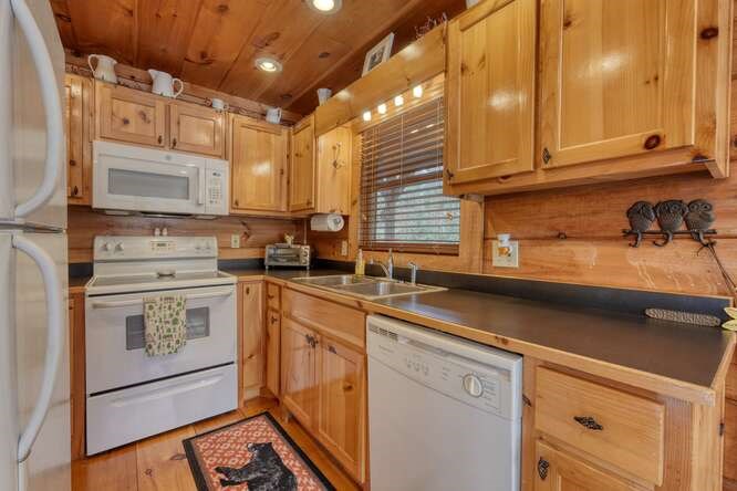 76 Channing Hollow Morganton, GA 30560 - Photo 10 of 47 a kitchen with stainless steel appliances granite countertop a sink stove and cabinets