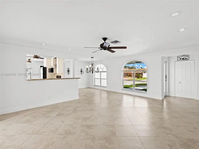 a kitchen with stainless steel appliances a refrigerator and microwave