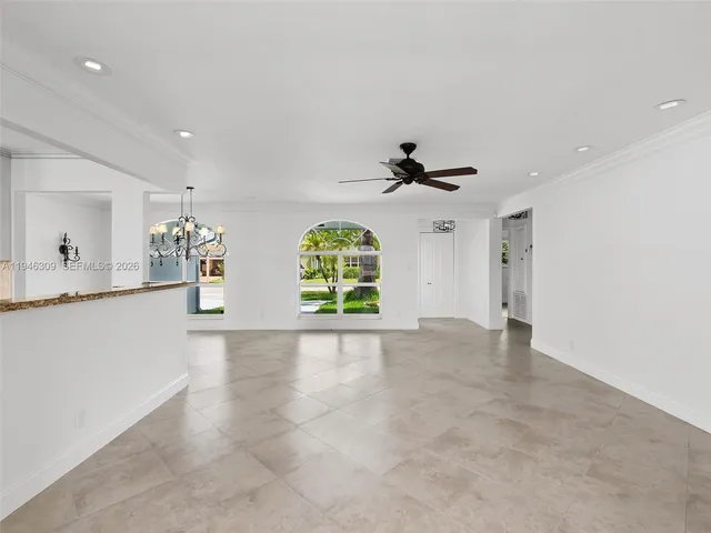 a kitchen with granite countertop a refrigerator oven a sink and dishwasher