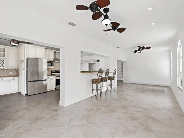 an empty room with wooden floor and closet
