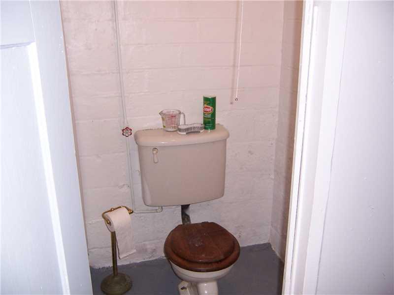 950 Highland Road Sharon, PA 16146 - Photo 13 of 22 Basement/Game Room. Toilet in basement