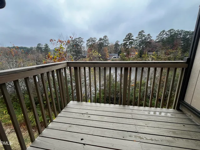 a view of a balcony with wooden floor