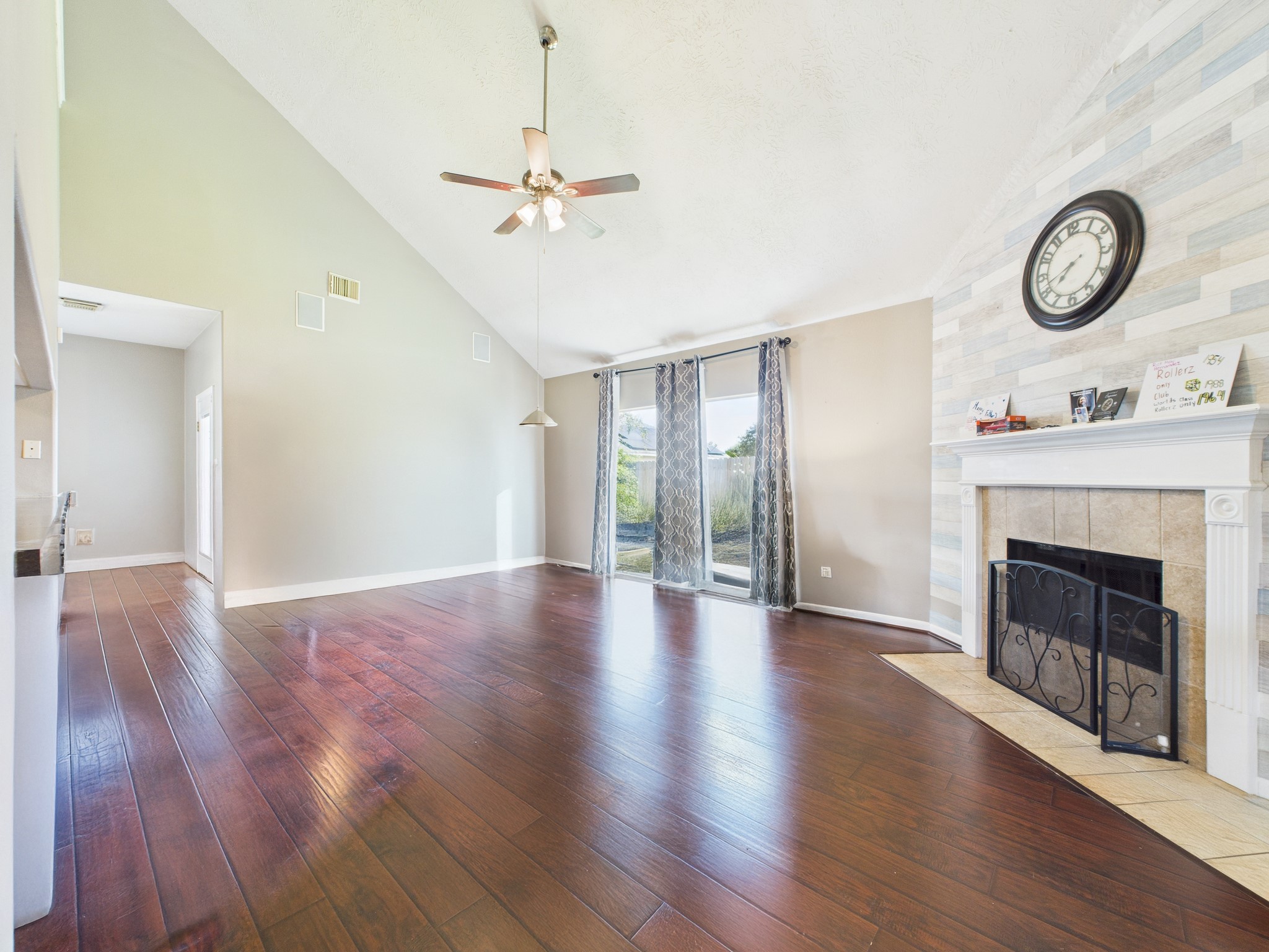 1484 Allison Street Alvin, TX 77511 - Photo 10 of 37 Living room offers vaulted ceilings and a gas fireplace!