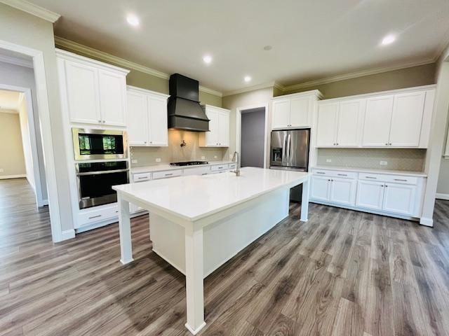 1717 Banks View Drive Raleigh, NC 27603 - Photo 10 of 33 a kitchen with kitchen island wooden cabinets a sink and a stove