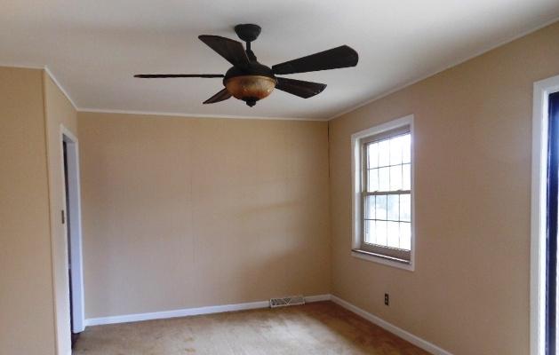 7709 Whitcomb Road Powell, TN 37849 - Photo 7 of 13 Den w/ slidding Doors to fenced back yar