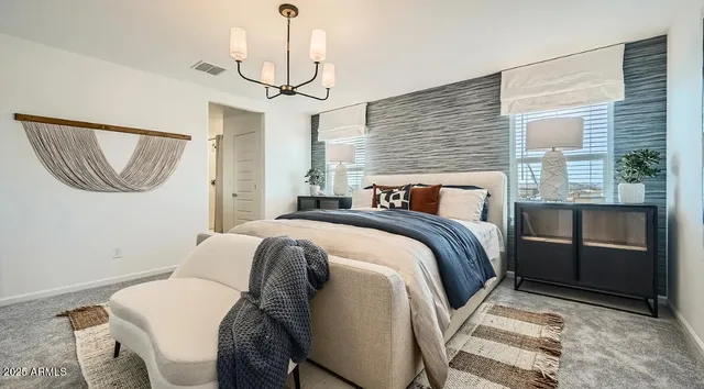 a bedroom with bed and wooden floor