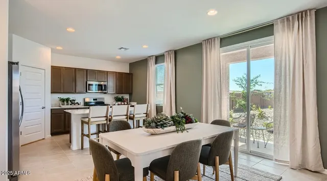 a kitchen with a sink cabinets and stainless steel appliances