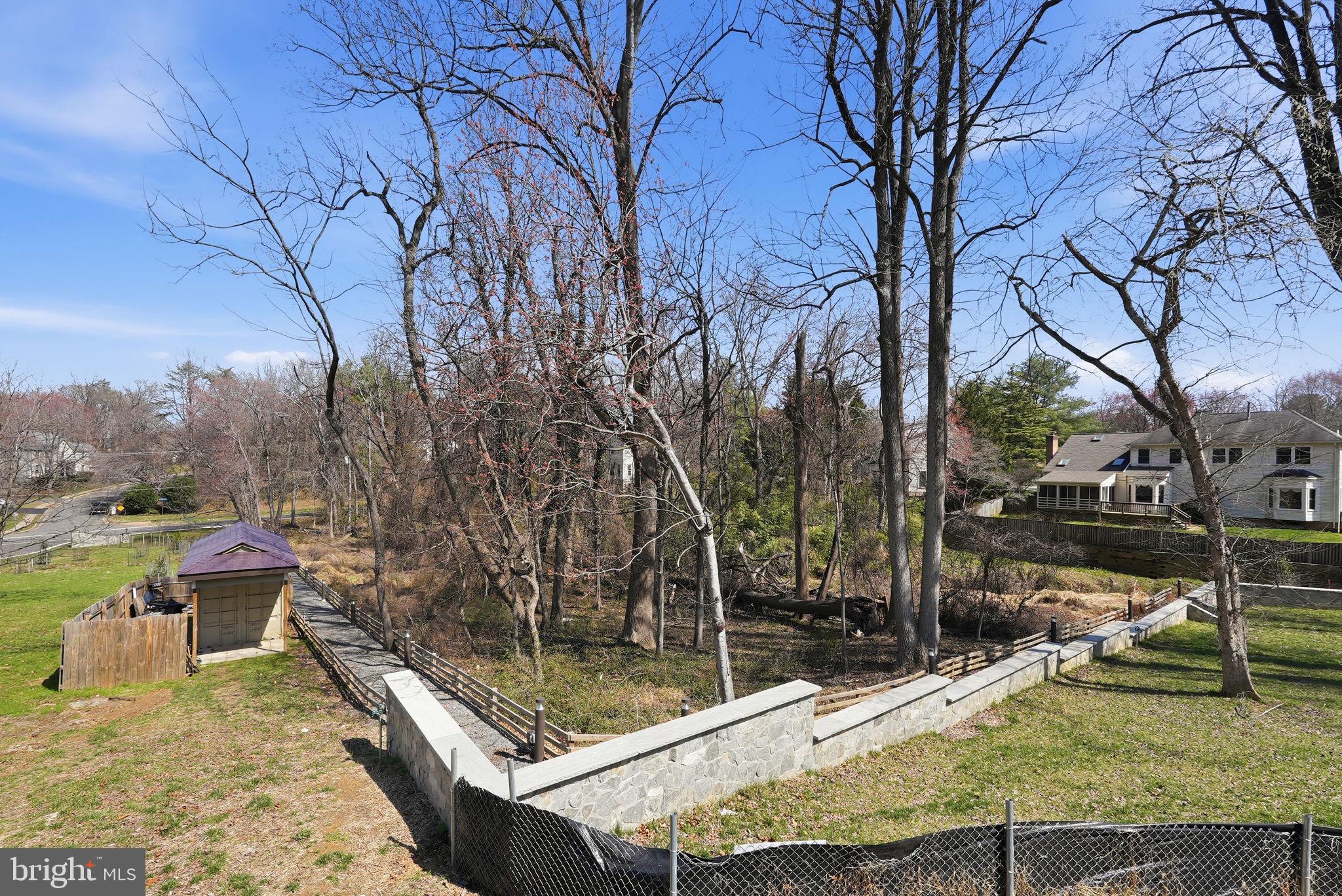 0 Linway Terrace McLean, VA 22101 - Photo 12 of 14 a view of a swimming pool with a patio and wooden fence