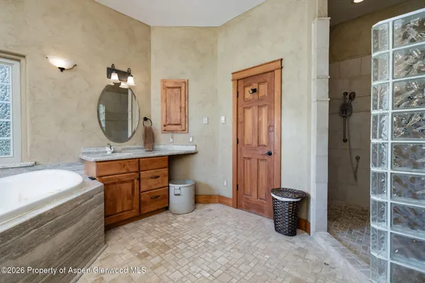 a spacious bathroom with a sink a toilet and shower