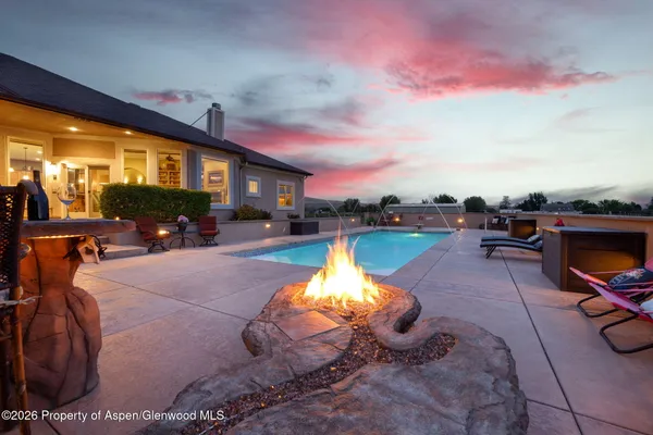 a swimming pool with outdoor seating