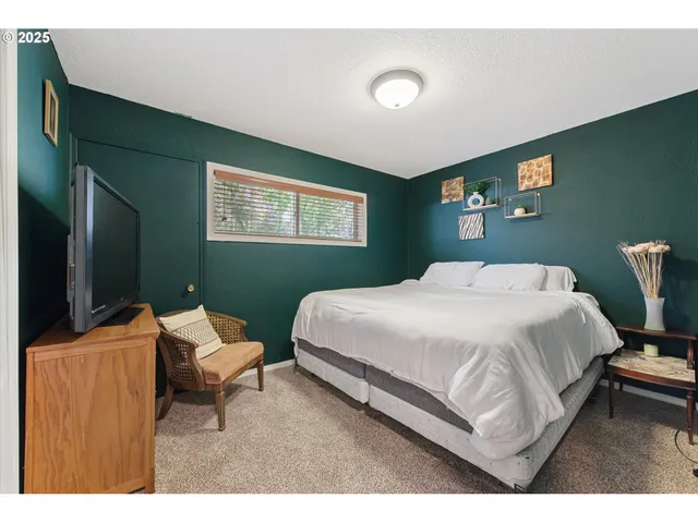 a bedroom with a bed and furniture