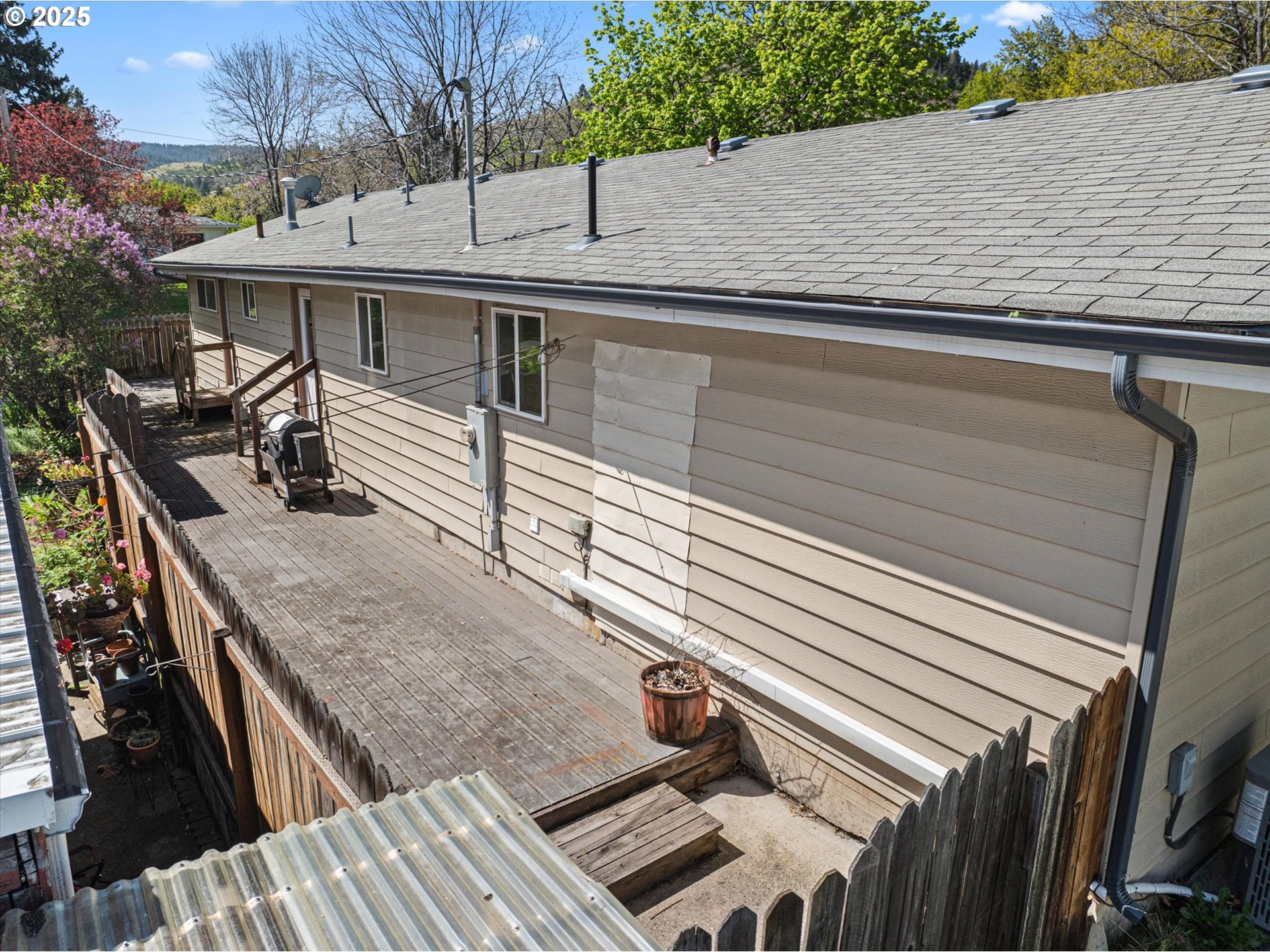 1701 Walnut Street La Grande, OR 97850 - Photo 20 of 22 a view of a roof deck with wooden deck and furniture