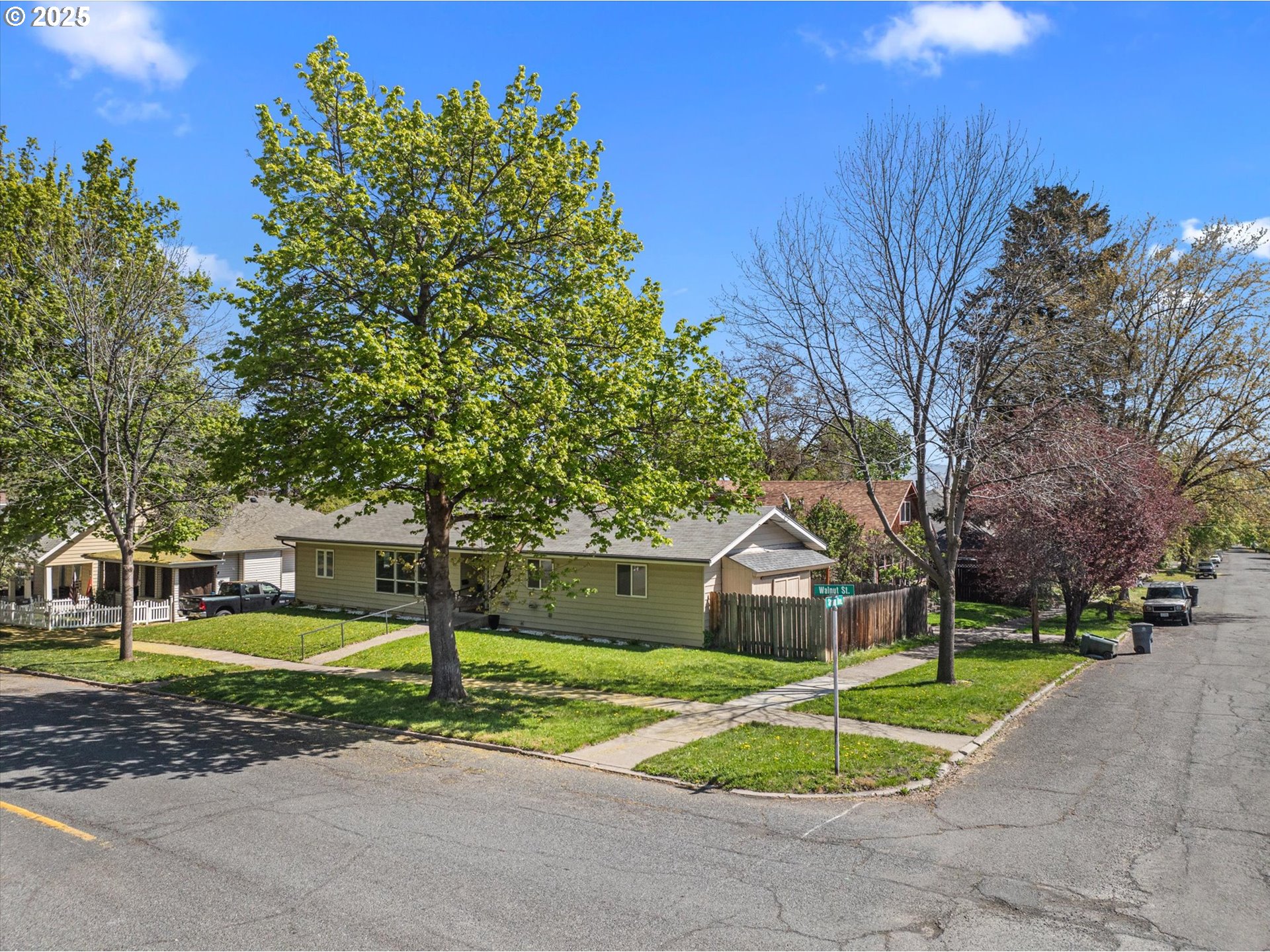 1701 Walnut Street La Grande, OR 97850 - Photo 2 of 22 a view of a house with a street and a trees