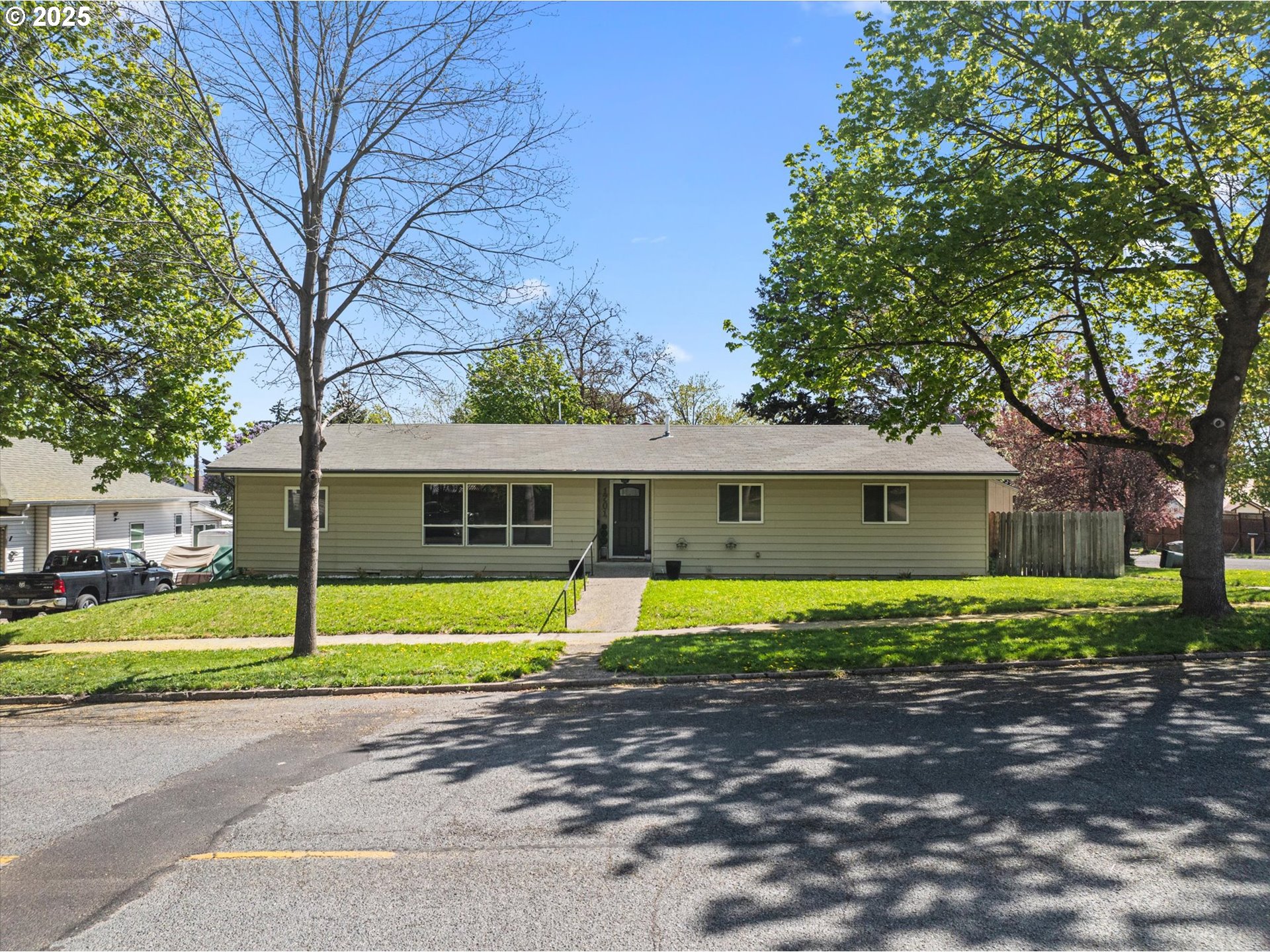 1701 Walnut Street La Grande, OR 97850 - Photo 3 of 22 a house that has a tree in front of it