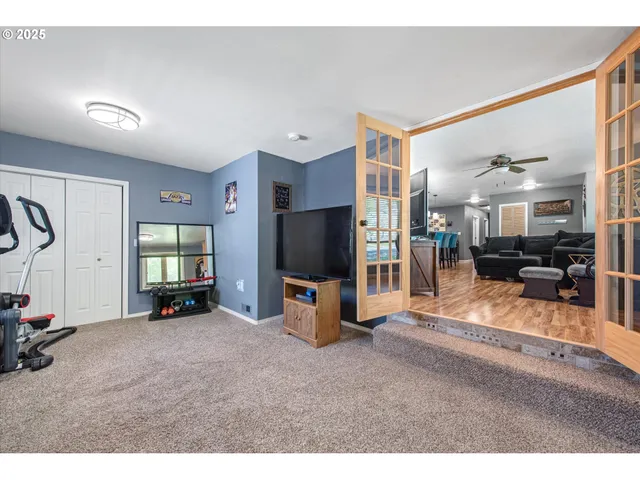 a view of a livingroom with furniture and a flat screen tv
