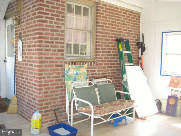 911 Village Road Folsom, PA 19033 - Photo 14 of 17 Enclosed Porch