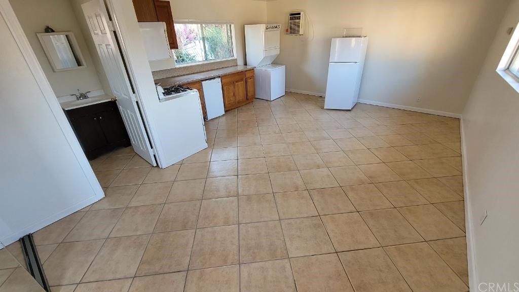 4667 Wellesley Way Riverside, CA 92507 - Photo 5 of 8 a view of a storage & utility room with a sink