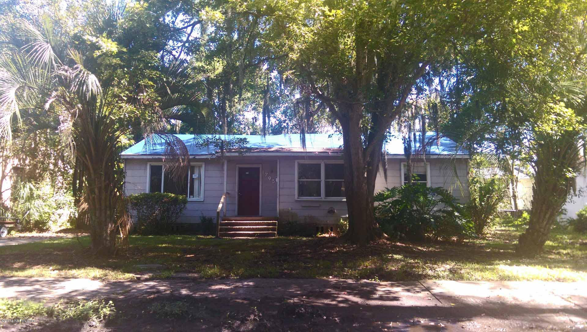 1795 Lilly Road East Jacksonville, FL 32207 - Photo 1 of 12 a front view of a house with garden